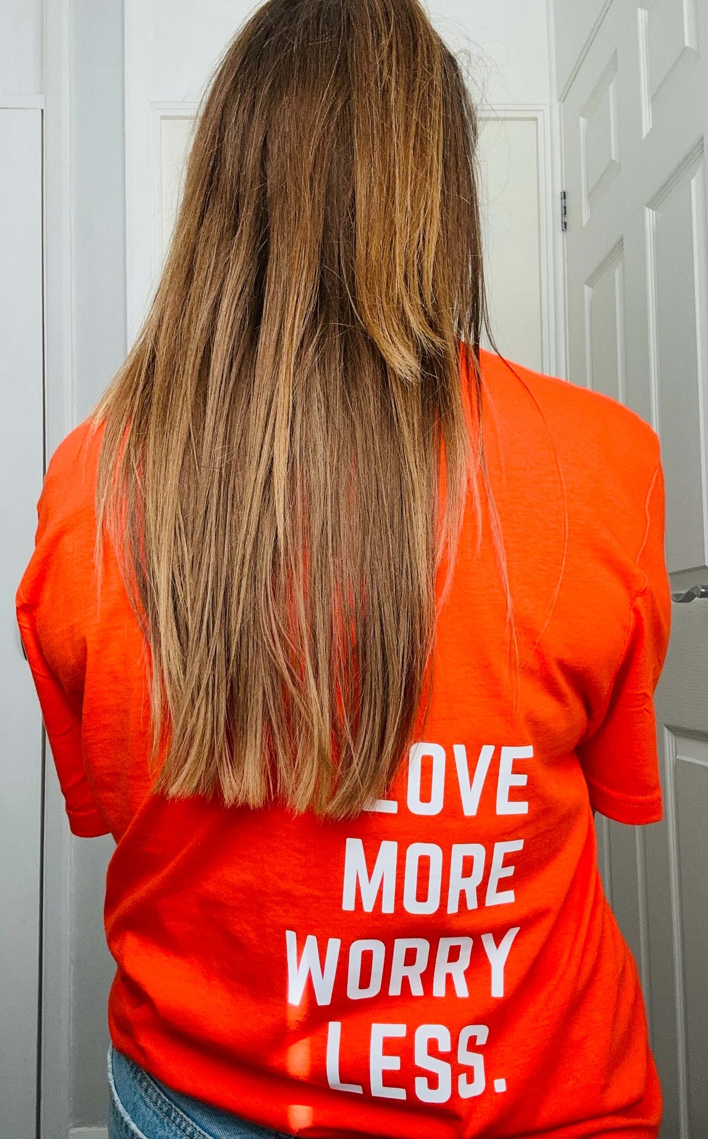 Orange crew neck T-shirt with Love more worry less design